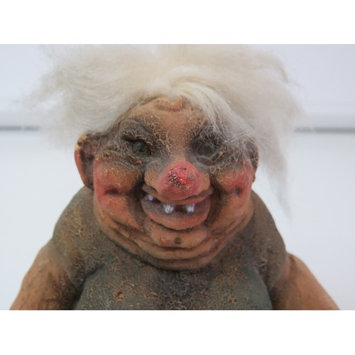 71 - Vintage 1999 Norwegian Nyform Troll fat smiling woman with a stick.
Height 15cms.