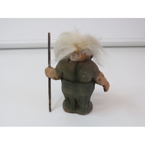 71 - Vintage 1999 Norwegian Nyform Troll fat smiling woman with a stick.
Height 15cms.