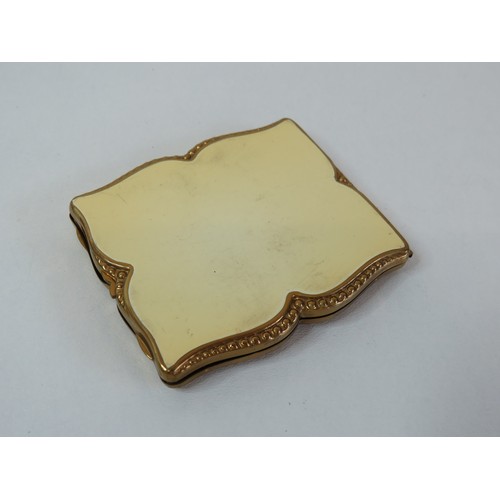 75 - Vintage Pygmalion compact with cream enamel and embossed gilt for loose powder. Made in England. 195... 