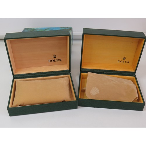 78 - Two green leather watch boxes.