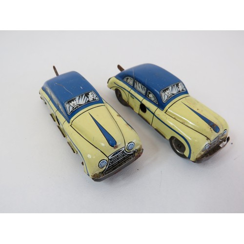 266 - Five vintage litho tin toys - two clockwork saloon cars, Glam toy saloon car, train carriage & airpl... 