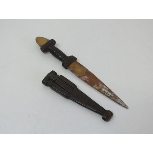 252 - Asian leather and brass dagger