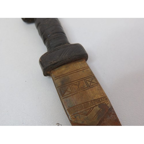 252 - Asian leather and brass dagger