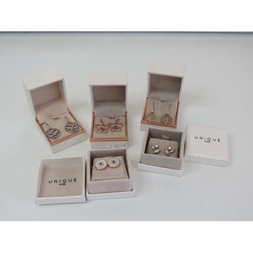 203 - Five pairs of Unique & Co 925 silver earrings - boxed as new with bag.