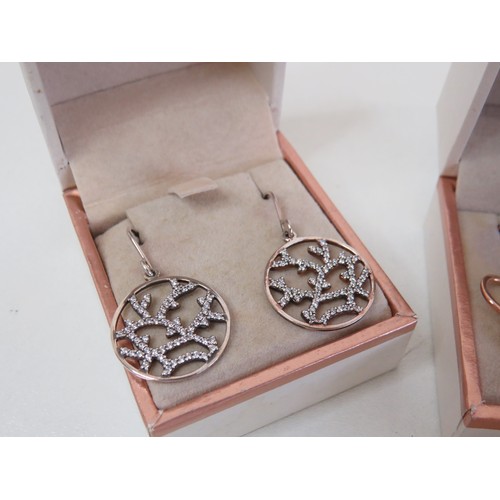 203 - Five pairs of Unique & Co 925 silver earrings - boxed as new with bag.