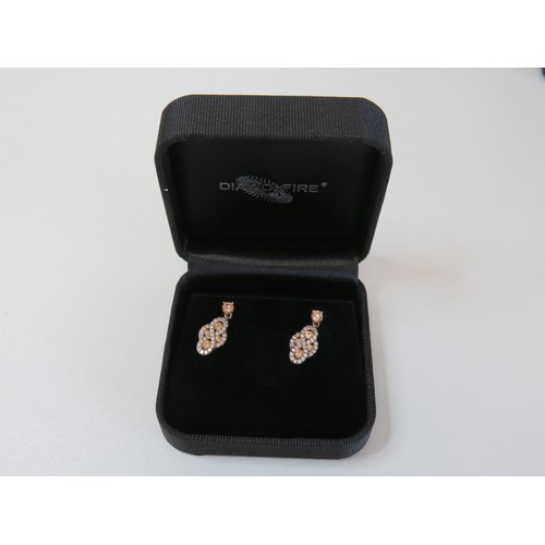 210 - Diamonfire 925 silver ring (size K) and two pairs of earrings all boxed as new with bag.