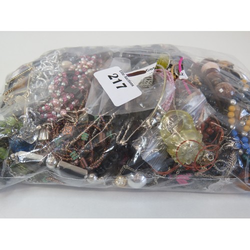 217 - Over 2kg of assorted costume jewellery.