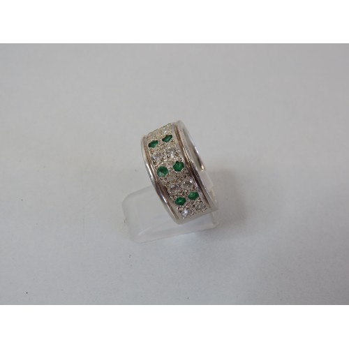 220 - 950 Platinum band ring set with diamonds & emeralds size V, weight 18g.