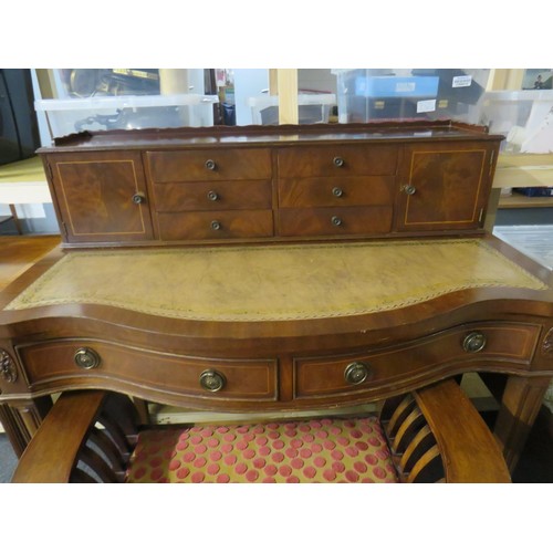 402 - Regency style serpentine front leather top writing desk and chair