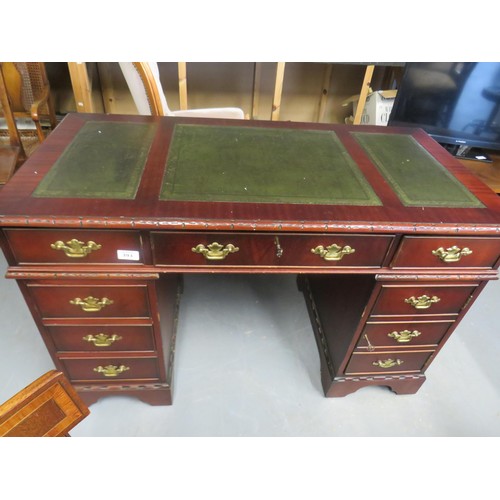 393 - Mahogany pedestal desk with green leather inset top and brass handles