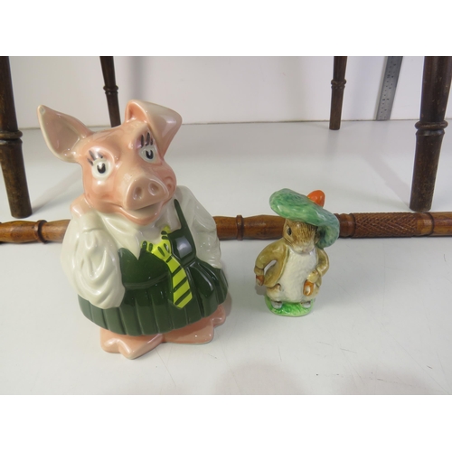 425 - Wooden table, wooden carved walking stick, wade pig money box, Benjamin bunny