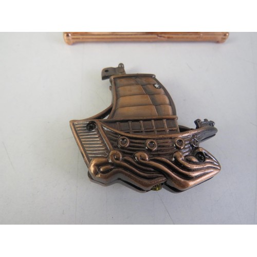 423 - Brass fireside ornaments and ship lighter