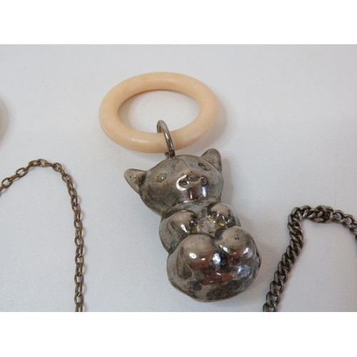 74 - Two vintage white metal baby teething rattles and three silver plated decanter labels.