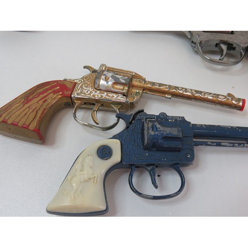 78 - Four vintage toy cap guns