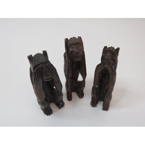 79 - Set of three carved wooden monkey figurines hear no, speak no, see no evil.