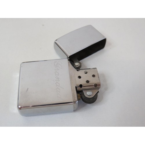 220 - Zippo lighter and a hipflask