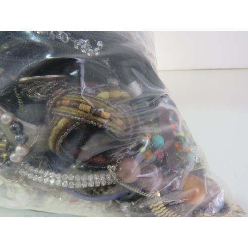 85 - 10kg bag of unsorted costume Jewellery.