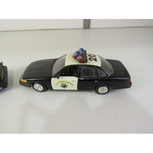 106 - 1/24 scale diecast ford crown Victoria police car and getaway car