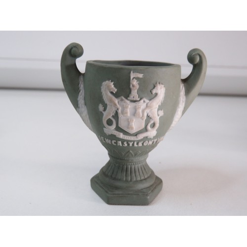 83 - Four Antique Wedgewood Jasperware items includes blue sugar shaker, two green lidded pots and Newcas... 