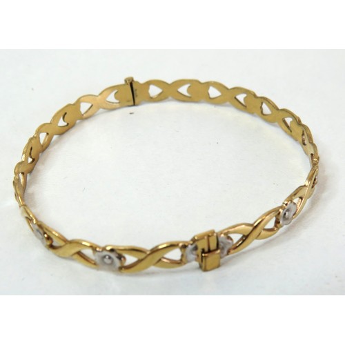 94 - Rolled gold hinged bangle with white flowers