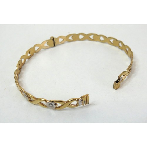 94 - Rolled gold hinged bangle with white flowers