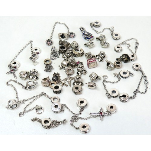 291 - Job lot of assorted 925 silver bracelet charms to include Pandora.