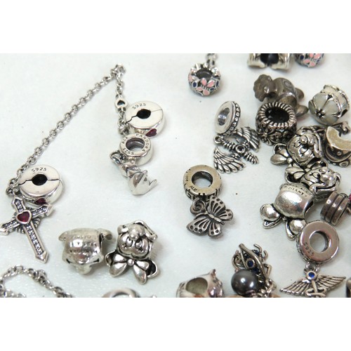 291 - Job lot of assorted 925 silver bracelet charms to include Pandora.