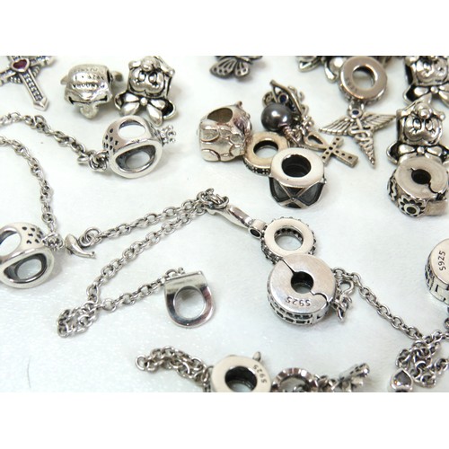 291 - Job lot of assorted 925 silver bracelet charms to include Pandora.