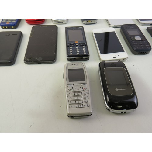 290 - A job lot of assorted mobile phones including Apple.