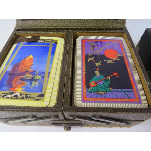 185 - Leather box of oriental playing cards, black lacquer box, brass detailing