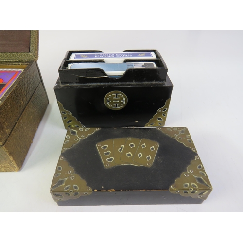 185 - Leather box of oriental playing cards, black lacquer box, brass detailing