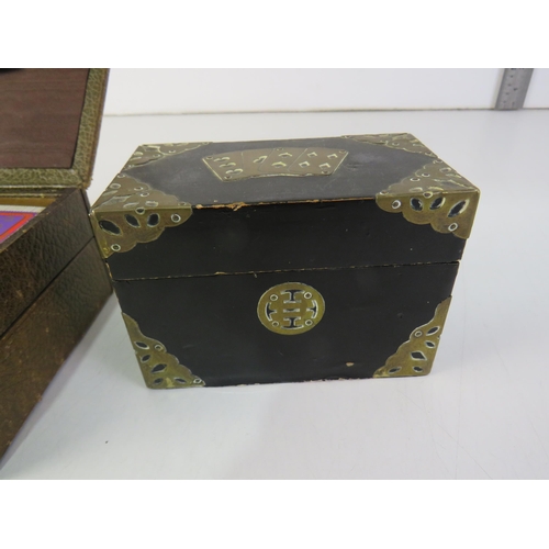 185 - Leather box of oriental playing cards, black lacquer box, brass detailing