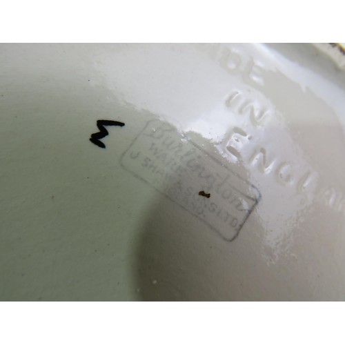 385 - Four toby jugs including two Burlington ware and Royal Doulton Beefeaters and Falstaff