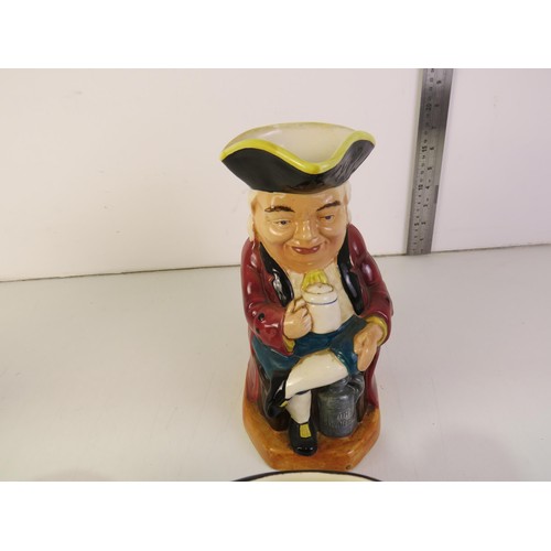 385 - Four toby jugs including two Burlington ware and Royal Doulton Beefeaters and Falstaff