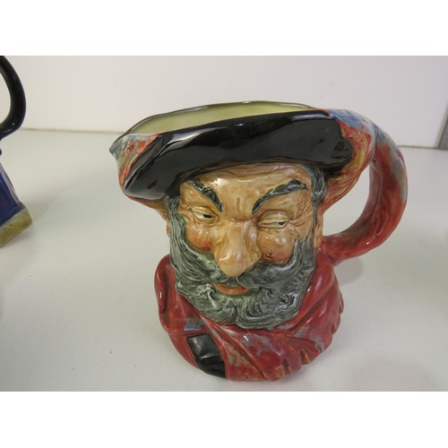 385 - Four toby jugs including two Burlington ware and Royal Doulton Beefeaters and Falstaff
