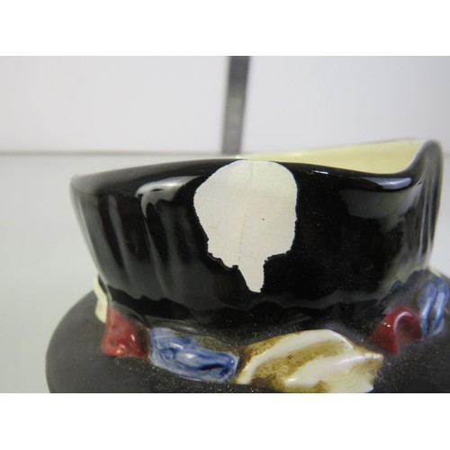 385 - Four toby jugs including two Burlington ware and Royal Doulton Beefeaters and Falstaff