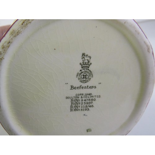 385 - Four toby jugs including two Burlington ware and Royal Doulton Beefeaters and Falstaff