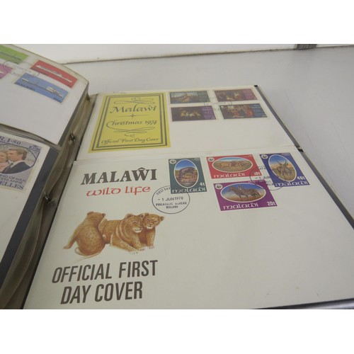 7 - Two albums full of assorted stamps and first day covers