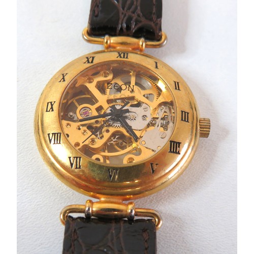 51 - Ladies Zeon Skeleton gold plated hand wind watch, working.