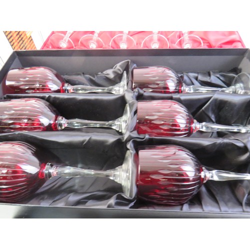 41 - Four boxed sets of crystal including Rockingham Crystal red glass wine glasses