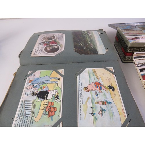 32 - Album and a tin full of assorted postcards