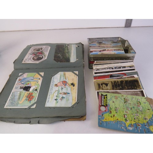 32 - Album and a tin full of assorted postcards