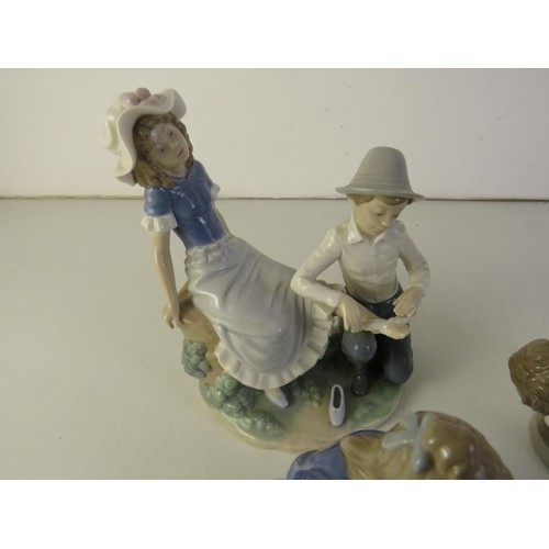 33 - Four assorted nao and lladro figures