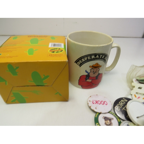 44 - Mixed lot of pin badges and dan dare mug