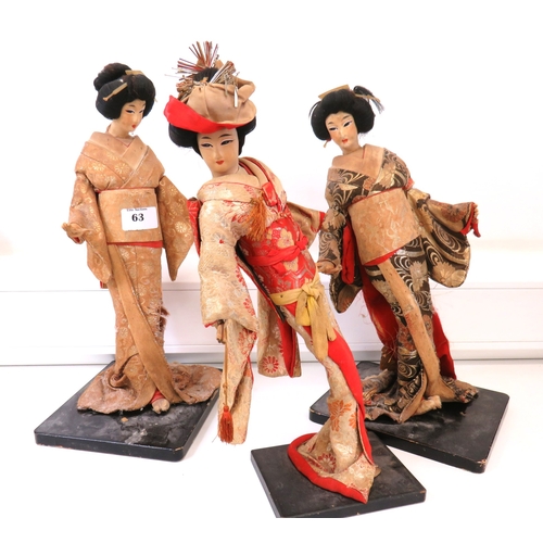 63 - Three large vintage Japanese Geisha/Komachi dolls with silk Kimonos on wooden stands.