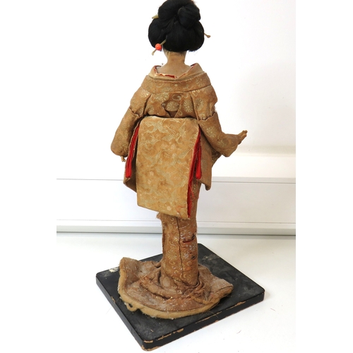 63 - Three large vintage Japanese Geisha/Komachi dolls with silk Kimonos on wooden stands.