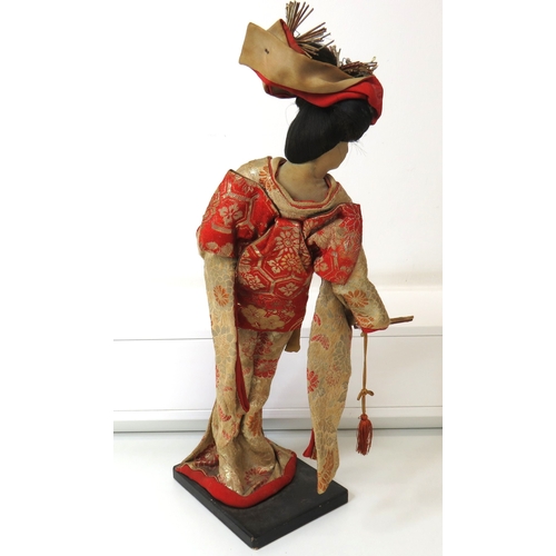 63 - Three large vintage Japanese Geisha/Komachi dolls with silk Kimonos on wooden stands.