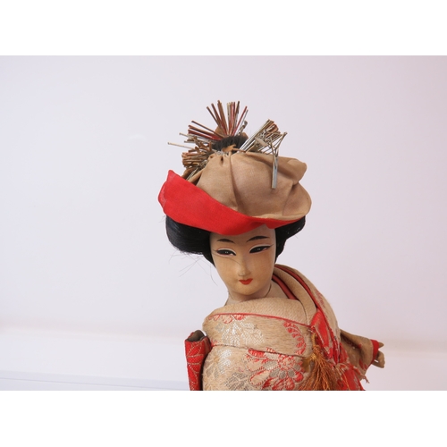 63 - Three large vintage Japanese Geisha/Komachi dolls with silk Kimonos on wooden stands.