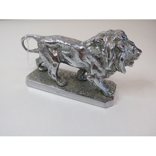 82 - Vintage heavy silver coloured lion figurine.