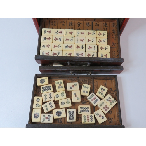 80 - Antique Chinese Mahjong set multi drawer wooden cabinet with bone and bamboo tiles.